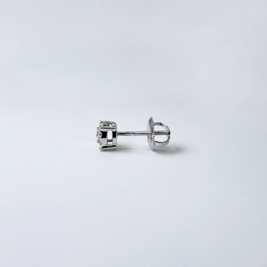 Broqueles solitario con diamantes.