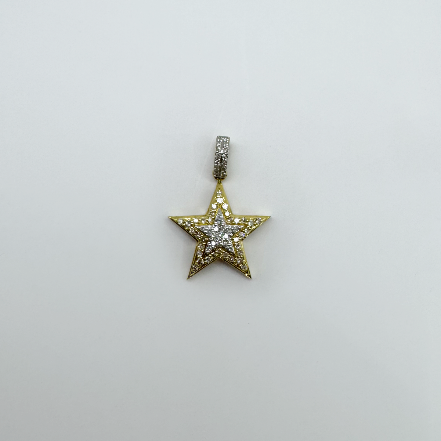 Dije estrella (doble) oro y diamantes