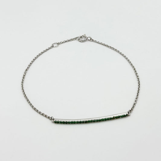 Pulsera barra esmeraldas oro blanco.