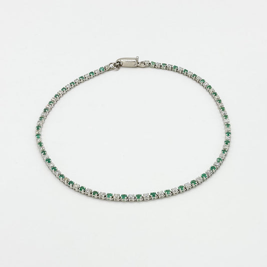 Pulsera tennis diamantes y esmeraldas.