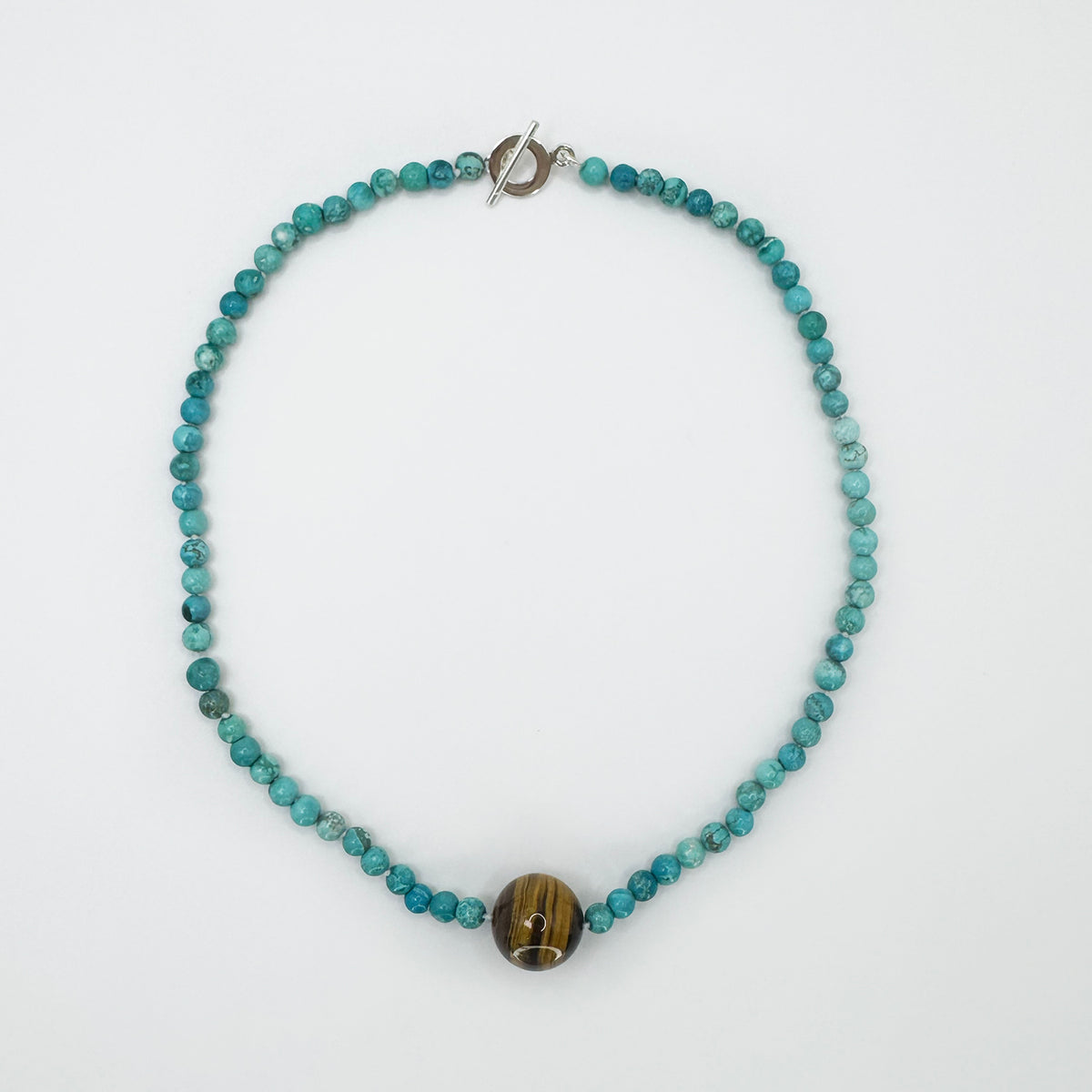 Collar turquesa mini con ojo de tigre.