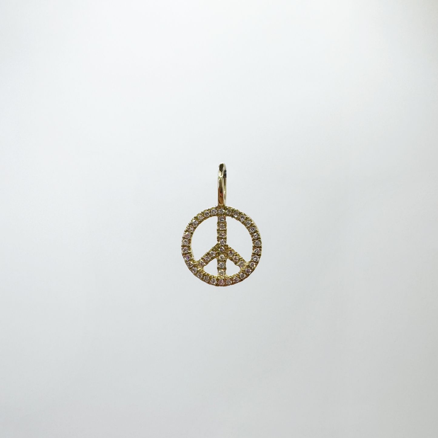 Charm mini peace and love diamantes y oro amarillo.