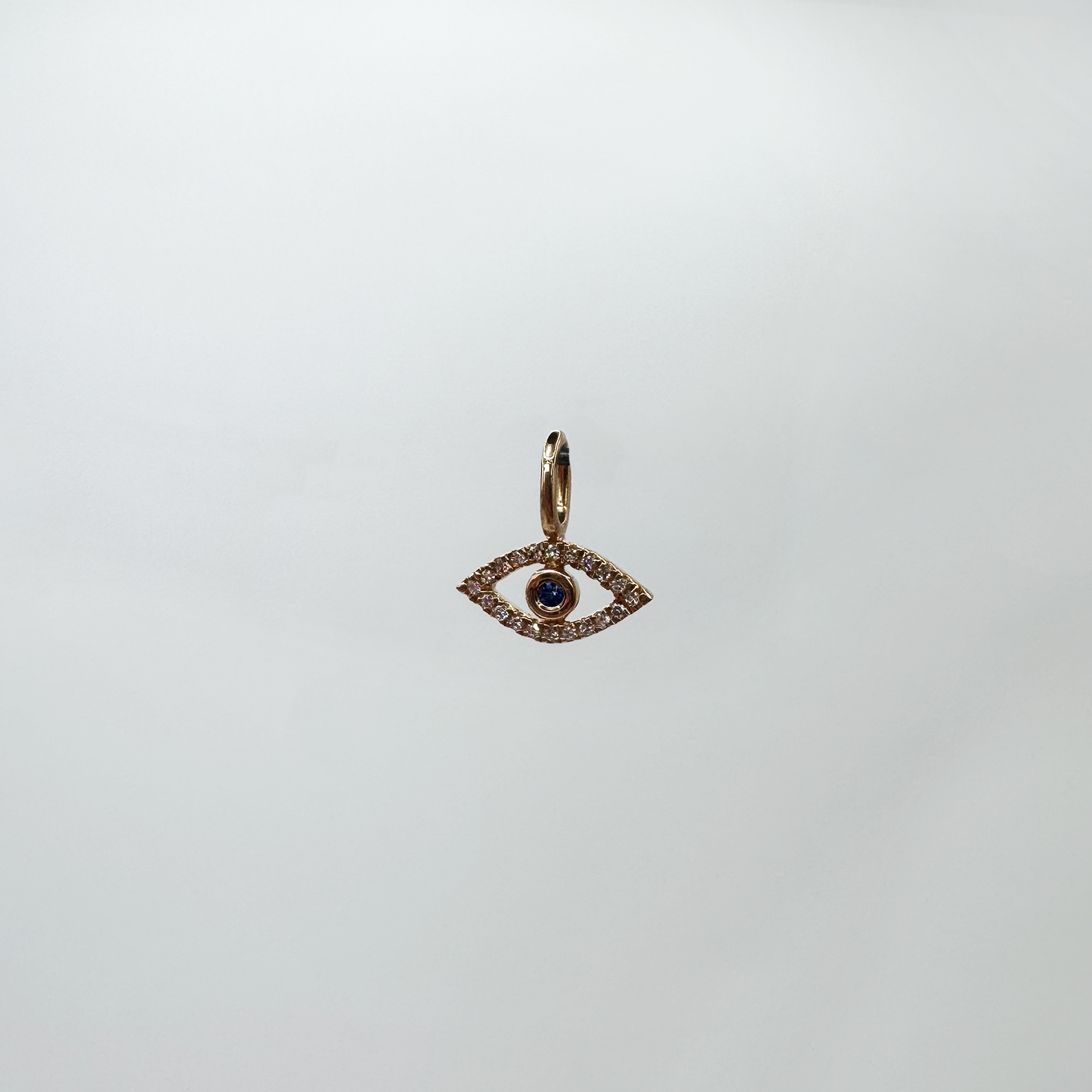 Charm mini evil eye diamantes oro rosa.