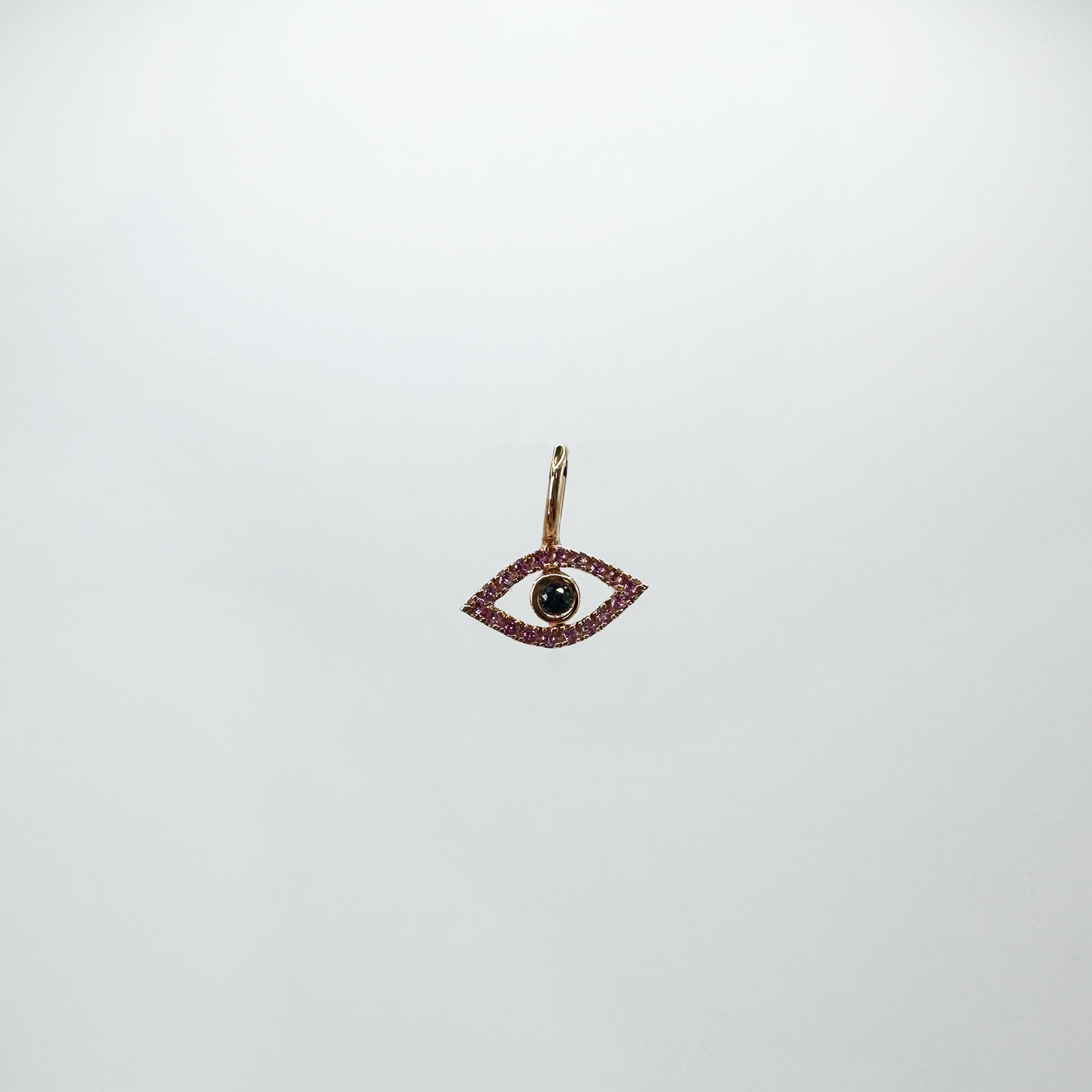 Charm mini evil eye zafiro rosa y oro rosa.