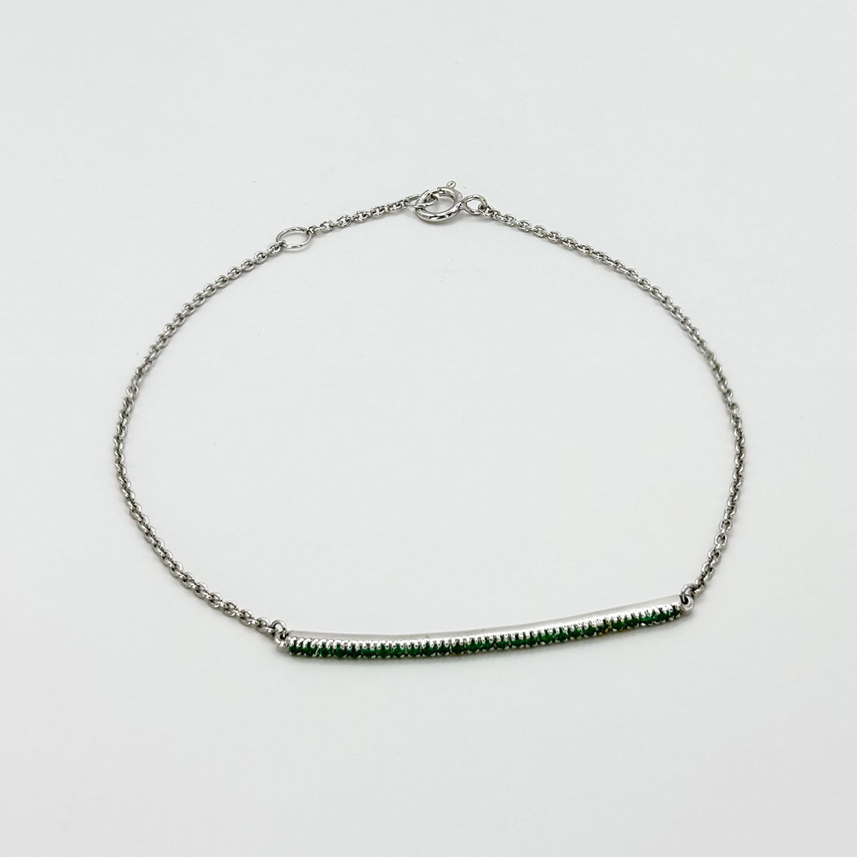 Pulsera barra esmeraldas oro blanco.