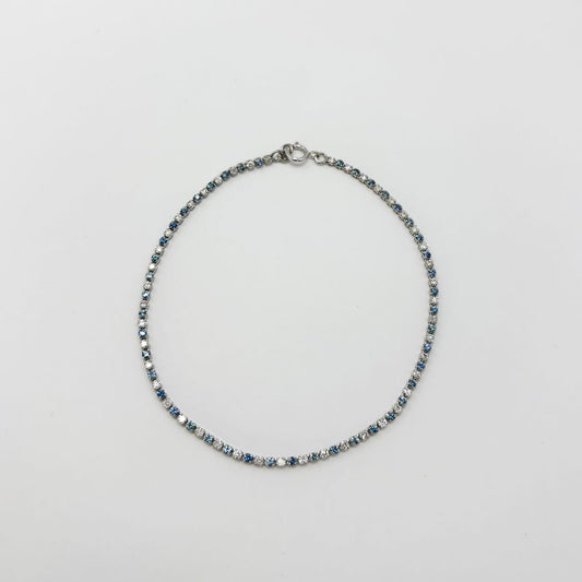 Pulsera tennis diamantes y zafiro. Oro blanco.