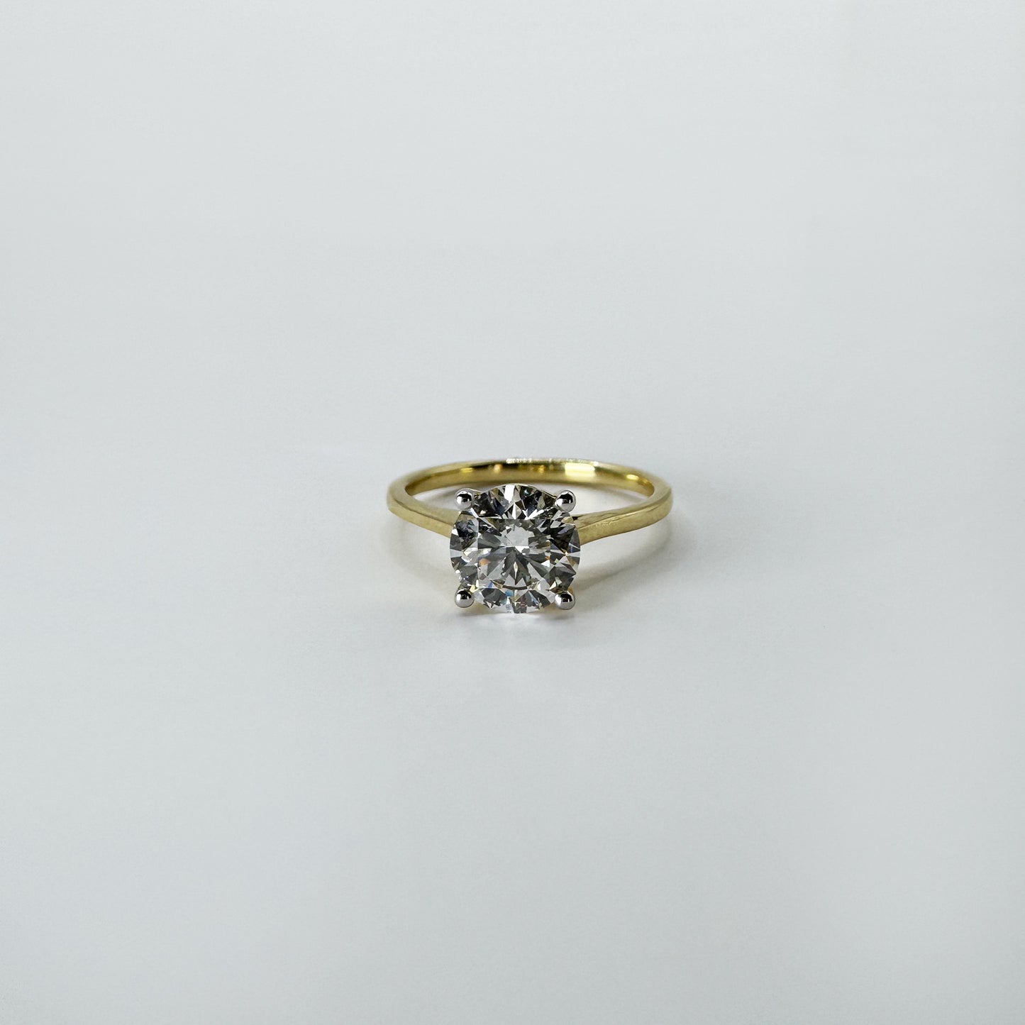 Anillo diamante redondo oro amarillo 1.5 cts.