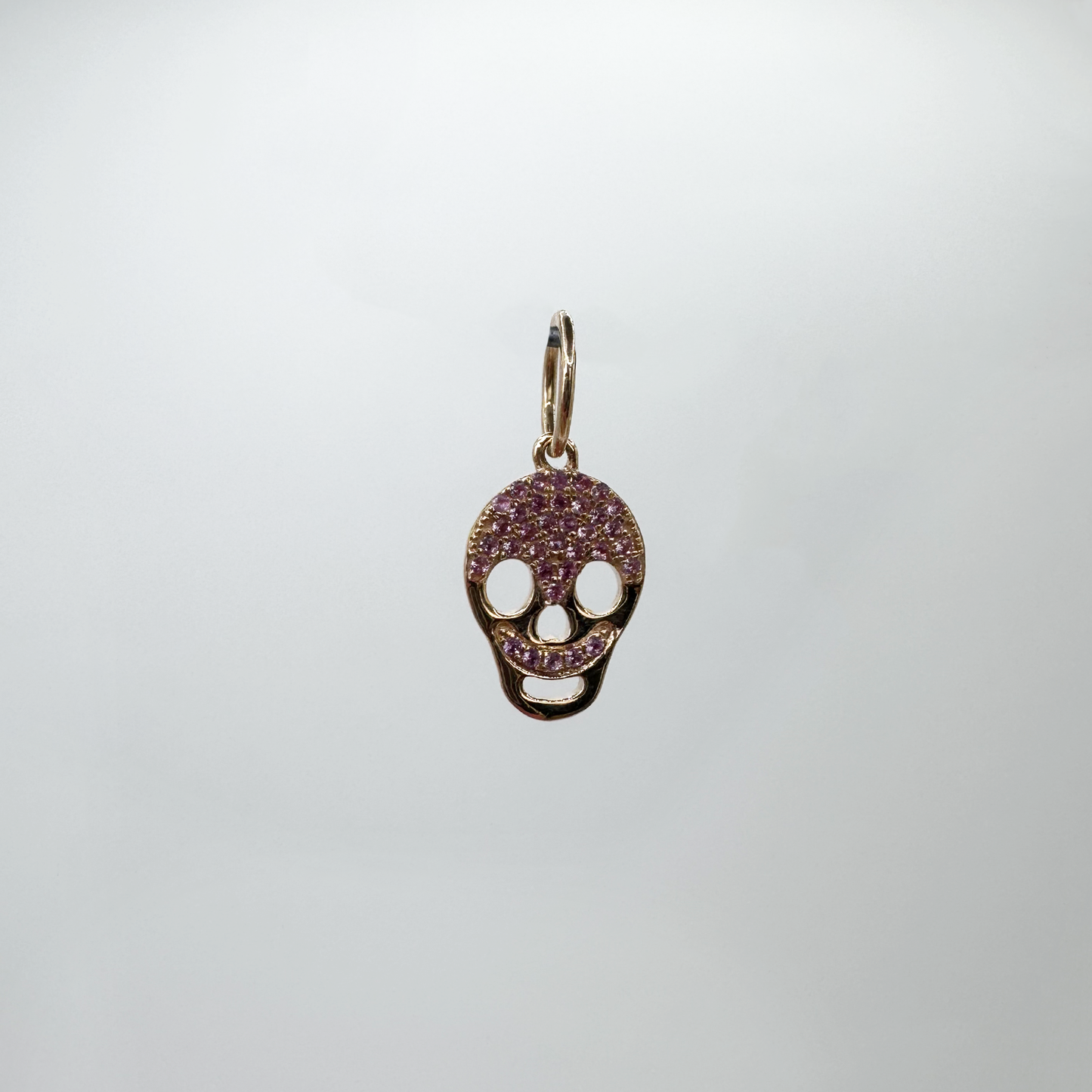 Charm mini skull zafiros rosa y oro rosa.