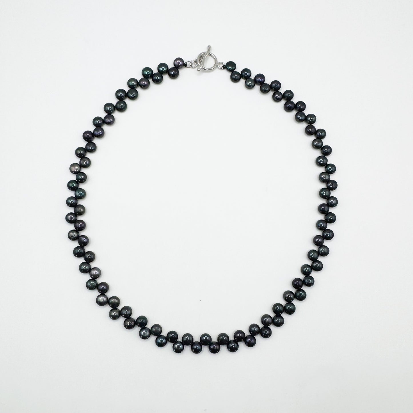 Collar perlas negras.