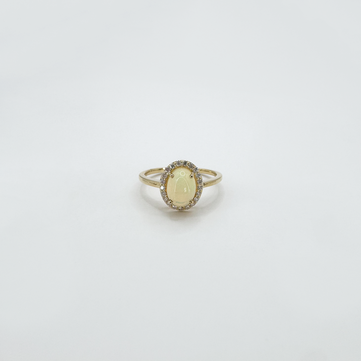 Anillo ópalo con halo diamantes oro amarillo 14k
