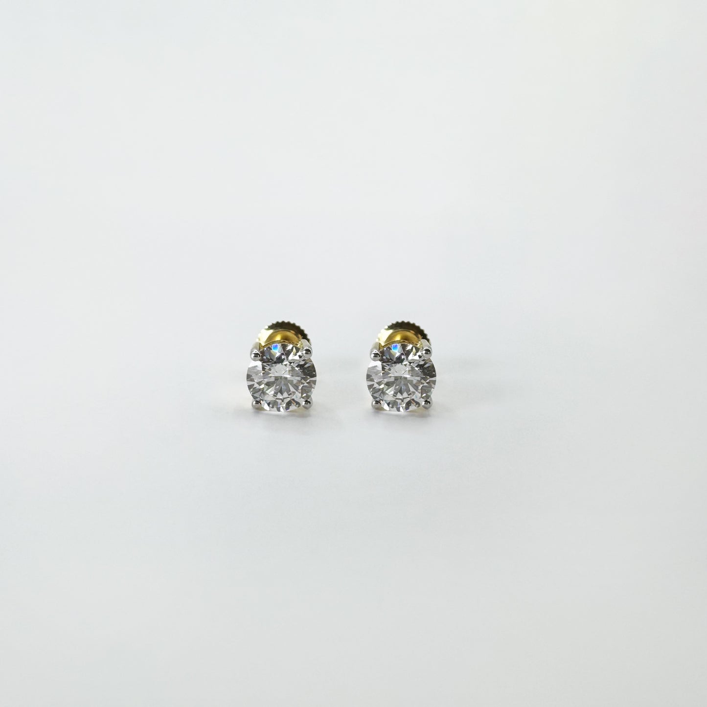 Aretes diamantes redondos oro amarillo 2 cts.