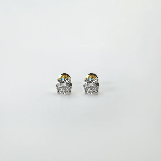 Aretes diamantes redondos oro amarillo 1.5 cts.