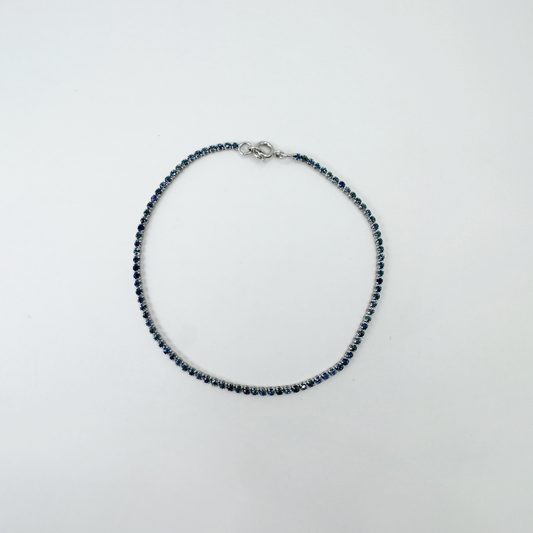 Pulsera tennis zafiros azules y oro blanco.