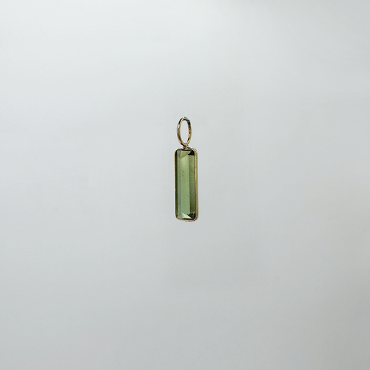 Dije turmalina y oro.