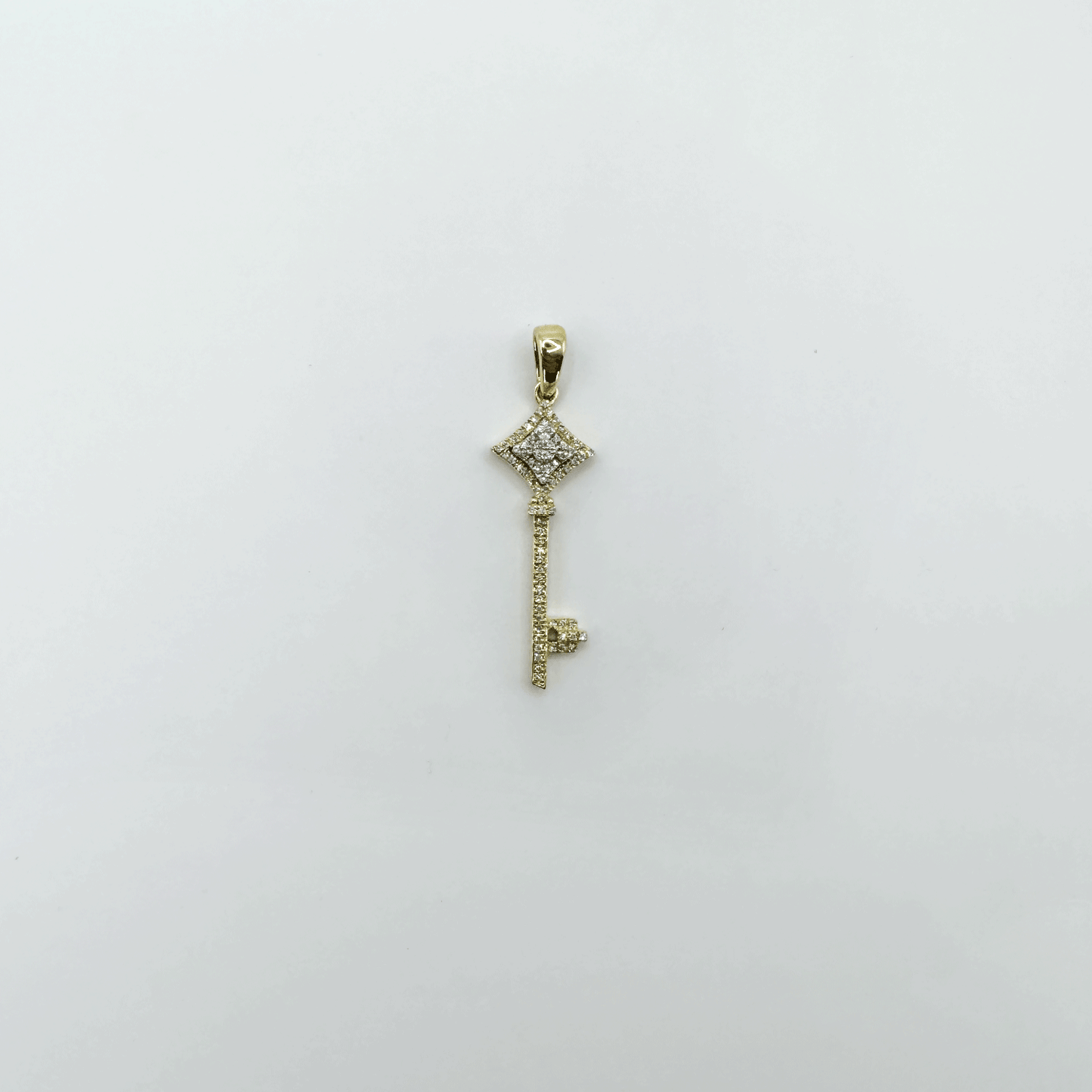 Dije llave oro y diamantes